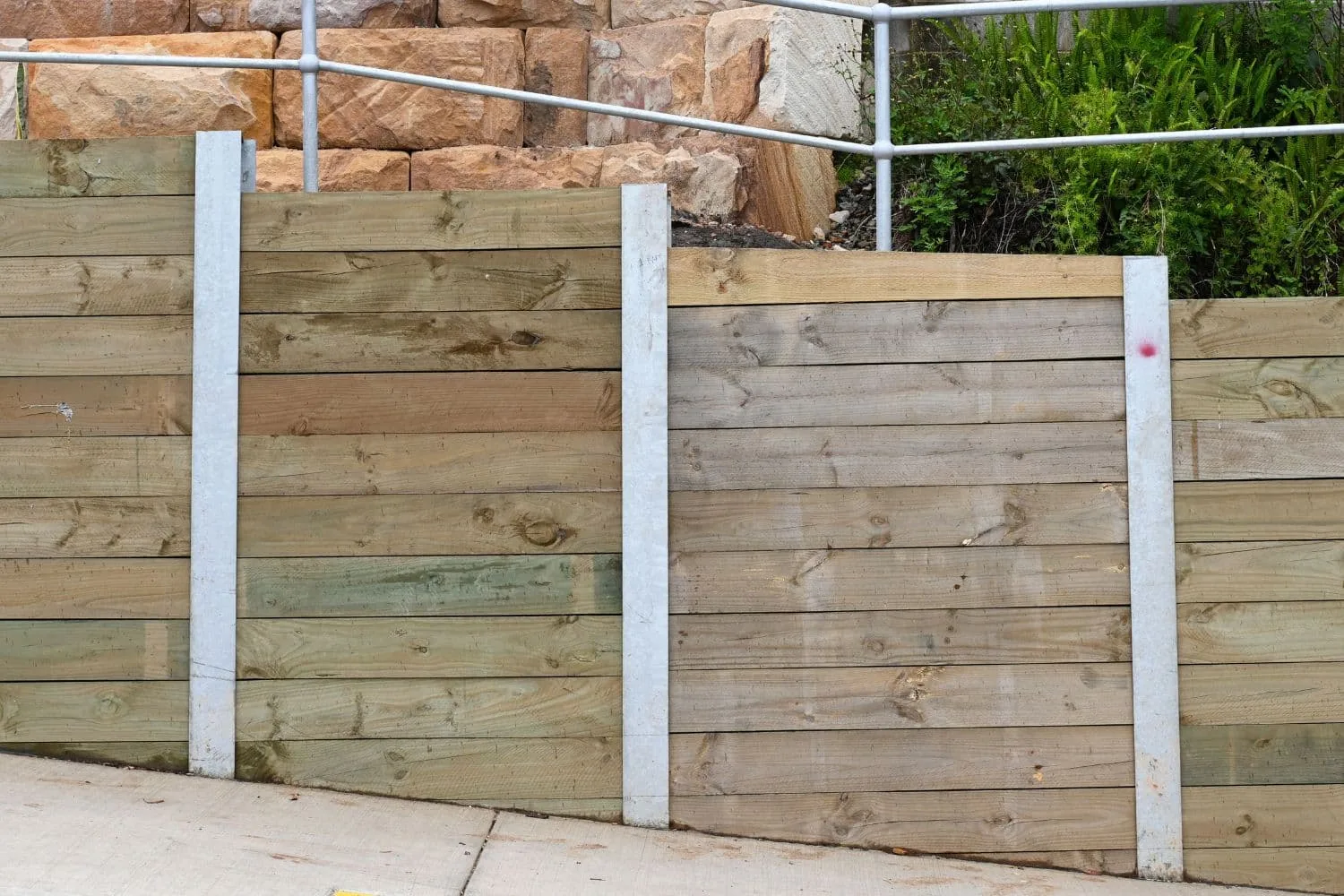 Timber retaining wall with treated pine sleepers